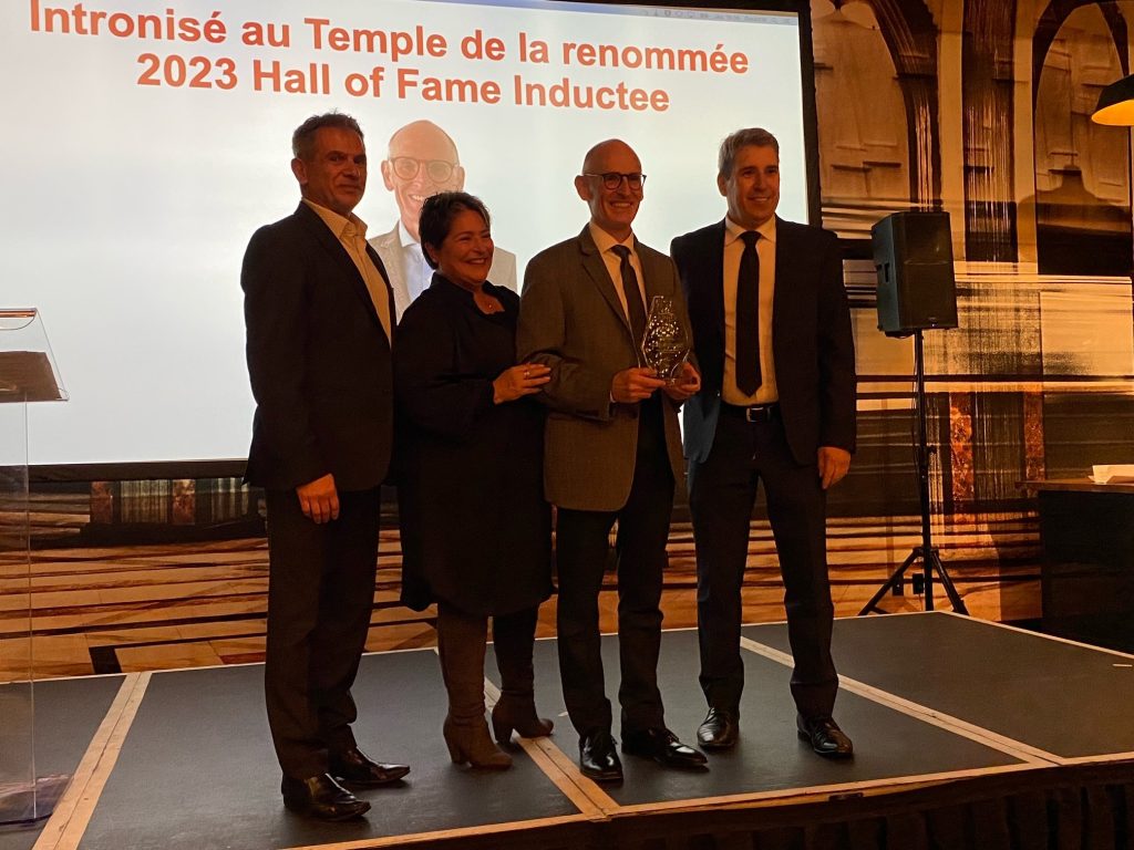 Harry Jacobs pictured with CHPTA President Sam Moncada, CHPTA Quebec Committee Chairman Christine Papineau from Garant, and Yvon Manny from DuraVent, after receiving his Hall of Fame award.